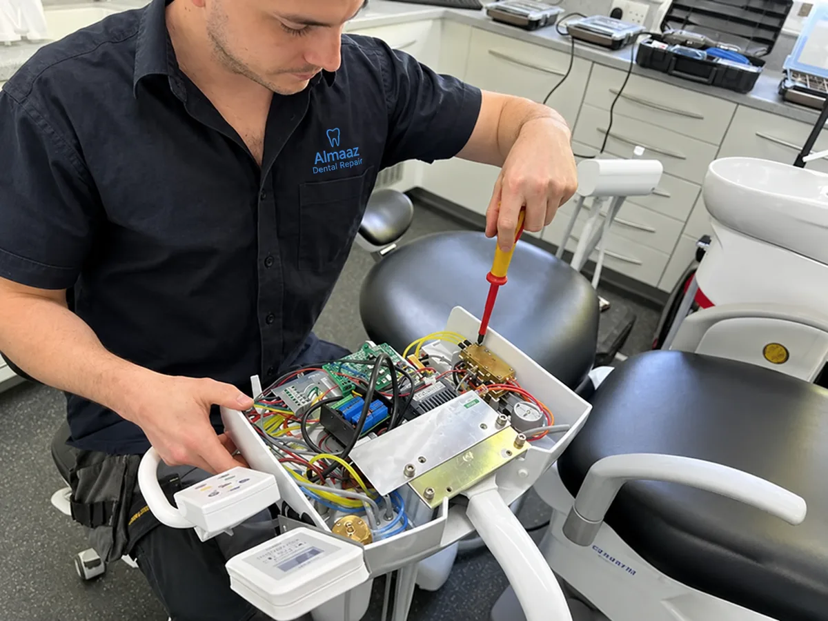 Almaaz Dental Repair technician servicing a dental delivery unit